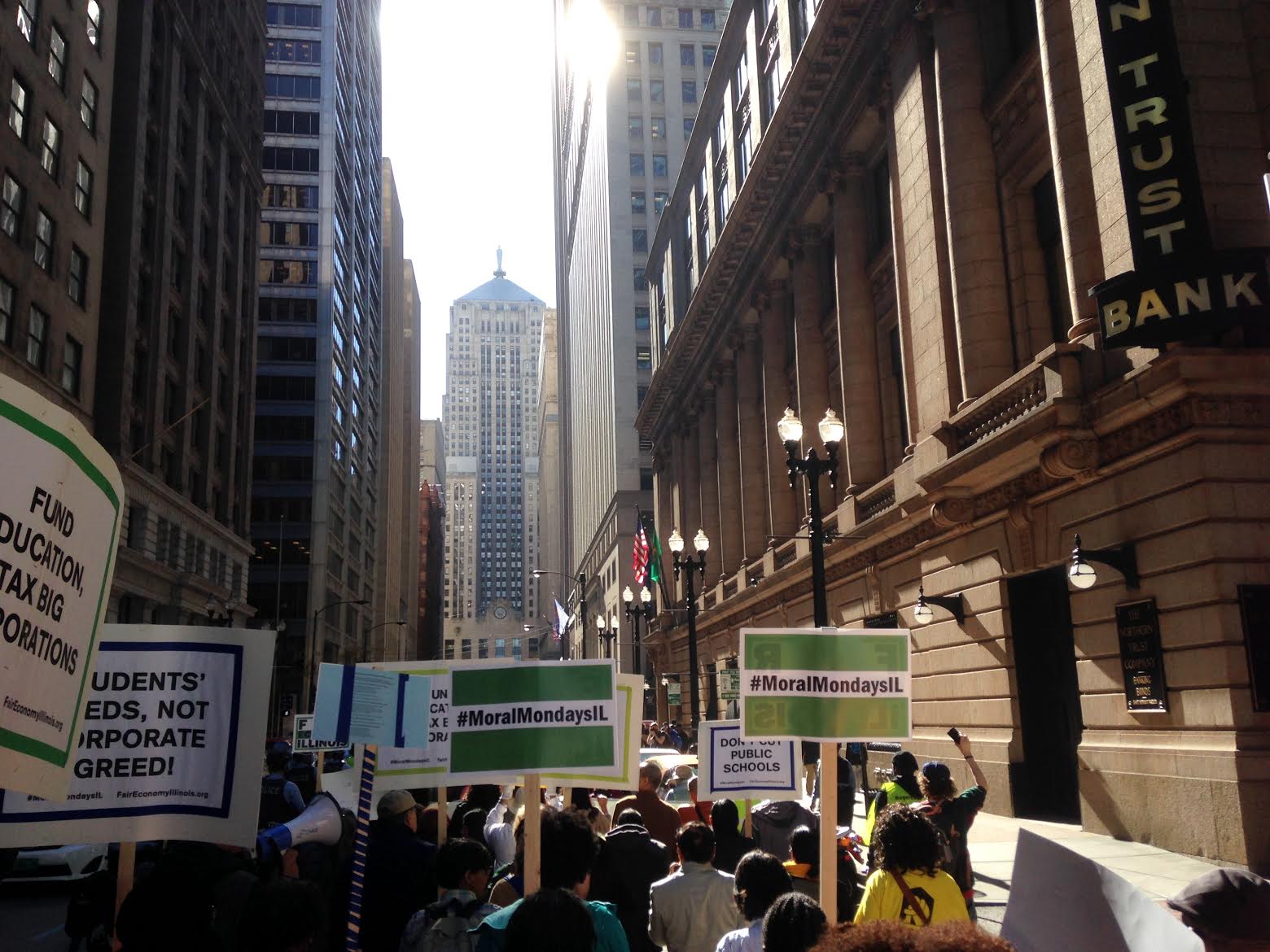 Protestors chant and march to the Board of Trade